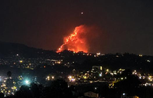 The Eaton fire seen from across the hills at night, January 2025